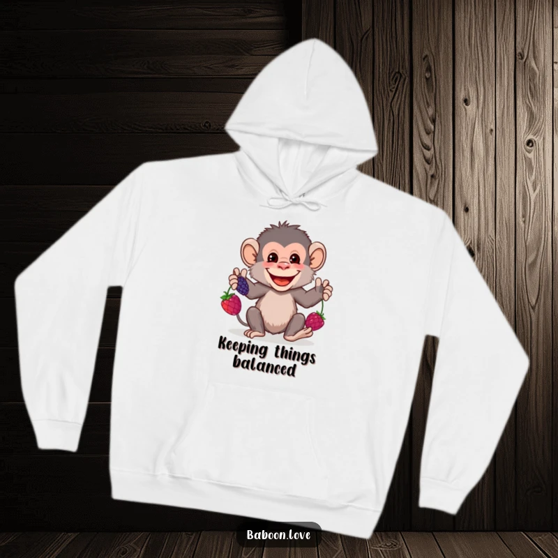 Funny Hoodie: A grinning baboon juggles colorful berries, offering a cozy and humorous design for those who enjoy a bit of playful skill.